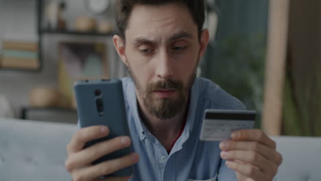 man checking credit card online