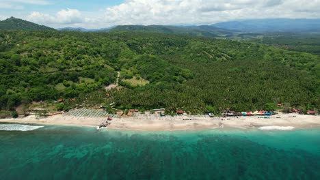 Panoramic-view-of-tropical-Pantai-Prasi-on-Bali-Island-with-beautiful-turquoise-ocean-and-white-sand-beach,-aerial