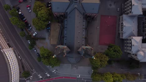 camera movement from top to back looking down on the church which looks like a cross built in the shape of a cross