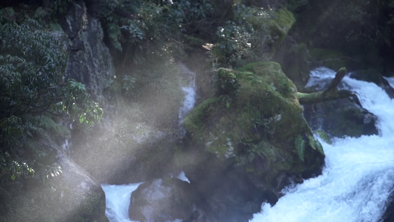 Waterfall with mossy rocks