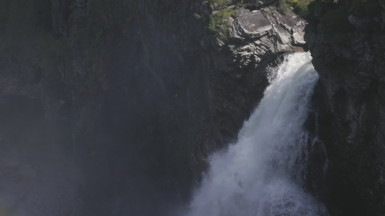 push out view of the huge Hallingsafallet cascade falling into the rocky canyon, in Sweden