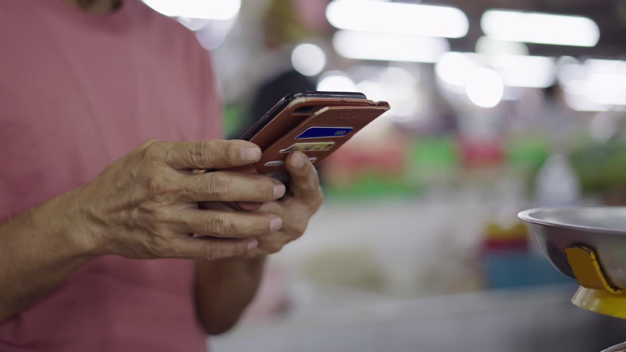 Person using smartphone for market transaction