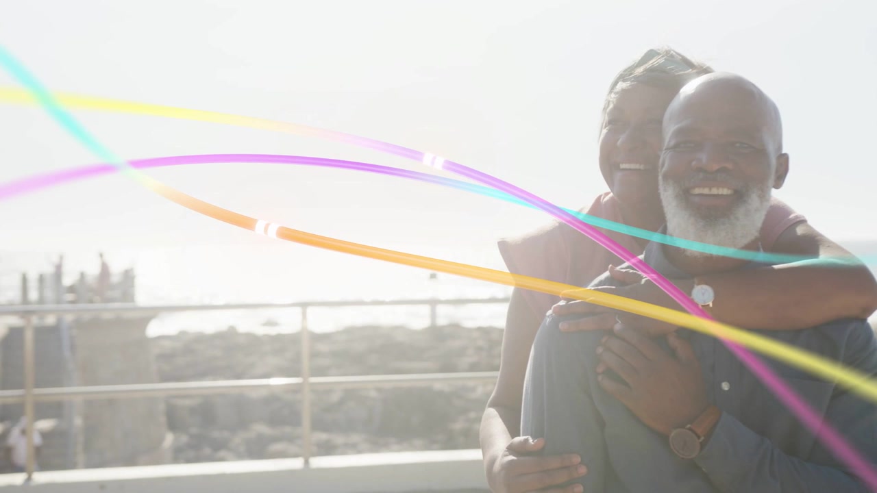 Woman hugging man from behind, sharing moment as animated ribbons weaving through frame for travel