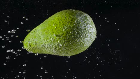 avocado splashing in water