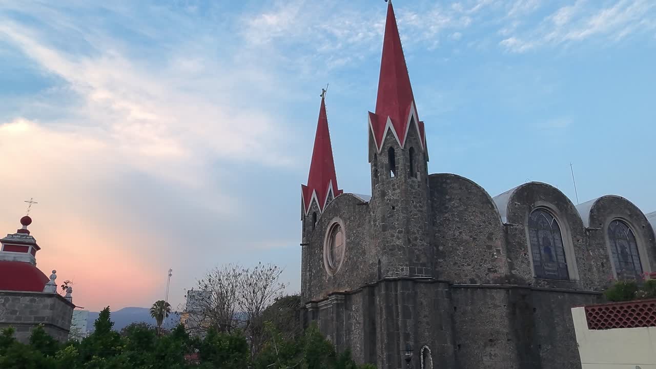 Descending shot of the spectacular Calvario Church at sunset with a view of its beautiful surroundings