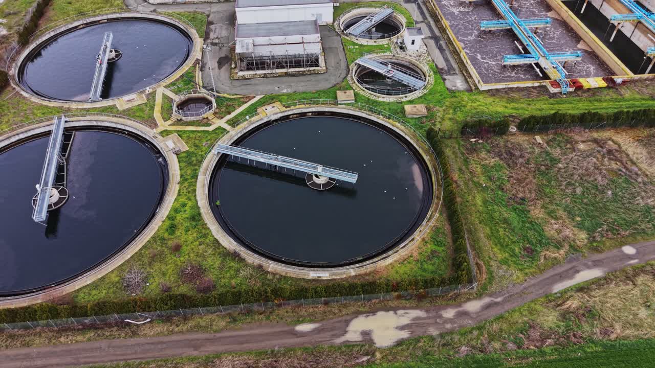Water purification plant in operation near a rural area during daylight