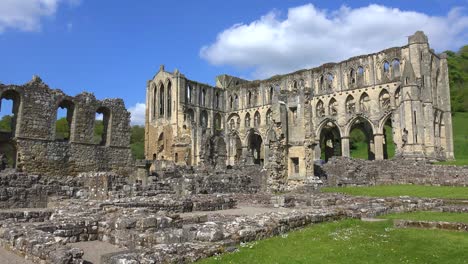 an establishing shot of rievaulx abbey abandoned cathedral in england