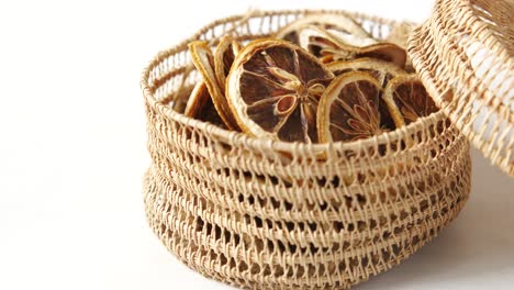 dried lemon slices in a wicker basket