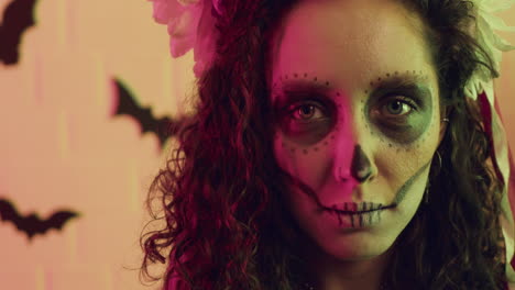 woman showing her teeth at camera at a halloween party