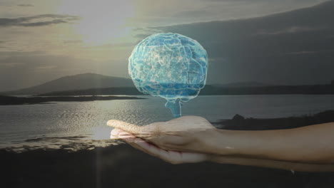 floating translucent blue 3d render brain hologram above cupped hands over calm lake at sunset