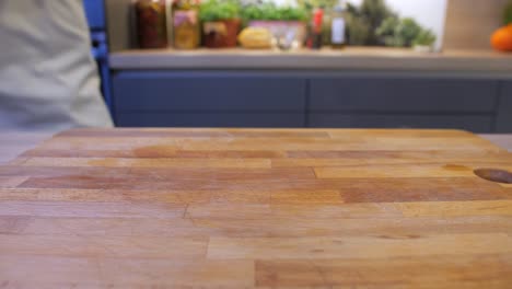 the-cook-puts-the-pudding-in-a-bowl-on-the-kitchen-counter