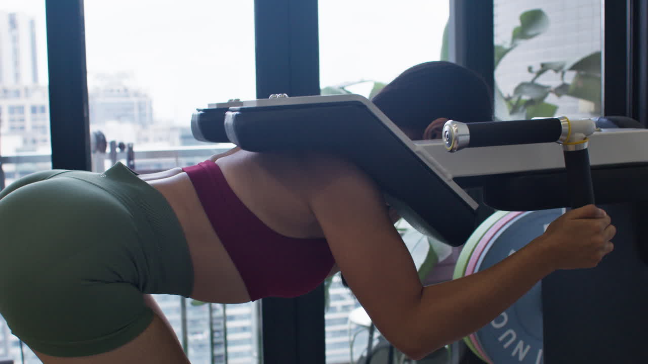 Woman doing squats in gym