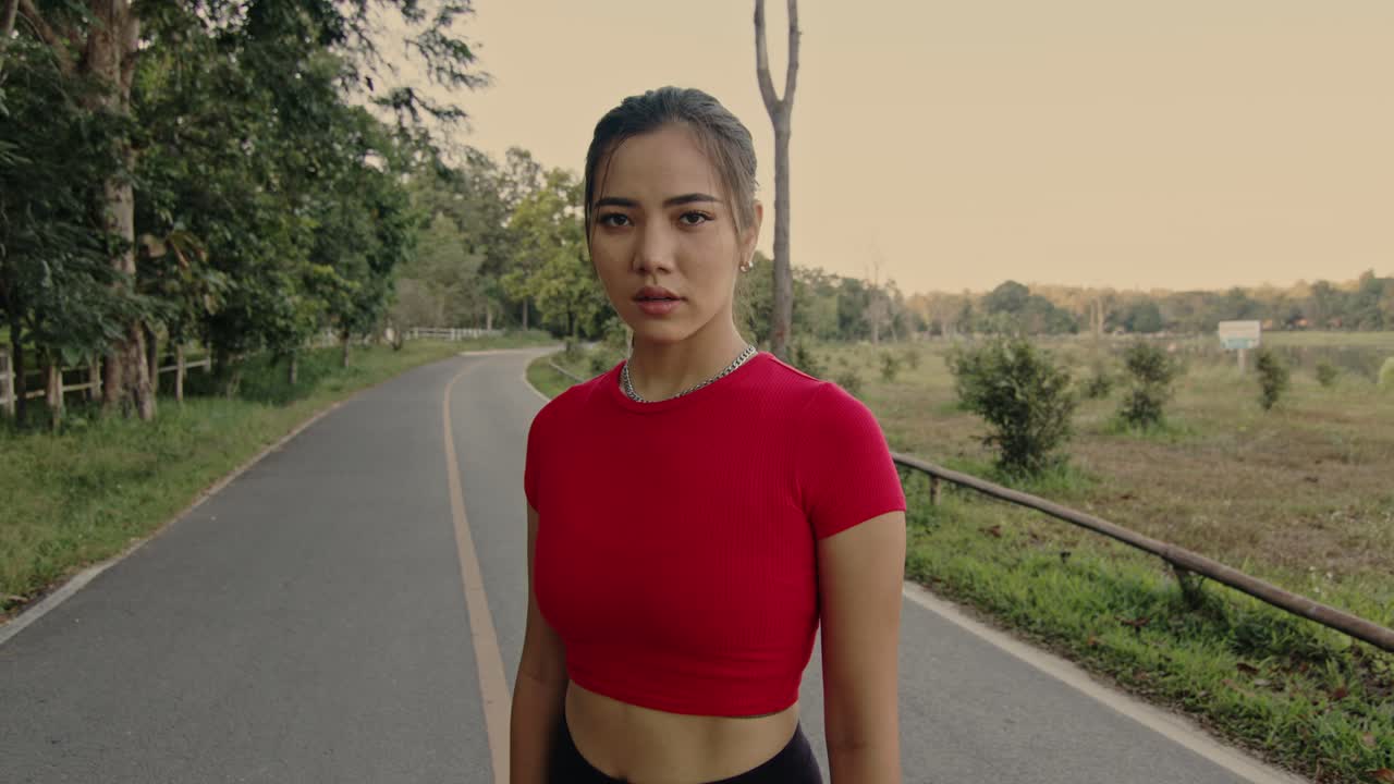 Woman Standing on a Road