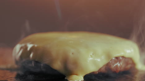 melting cheese on burger