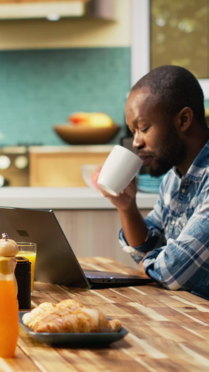 Vertical Video African american lovers chatting over their coffee at the breakfast table
