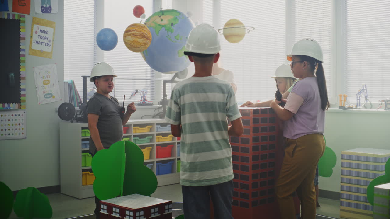 Children and Teacher in a Classroom with Planet Models
