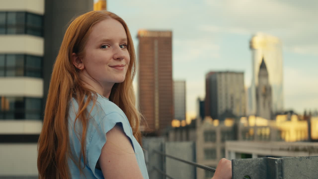 Redhead Woman on a Rooftop with Cityscape Background