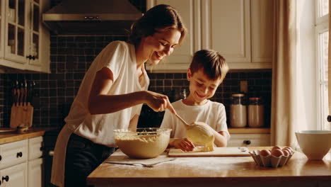 mother and son baking together in the kitchen