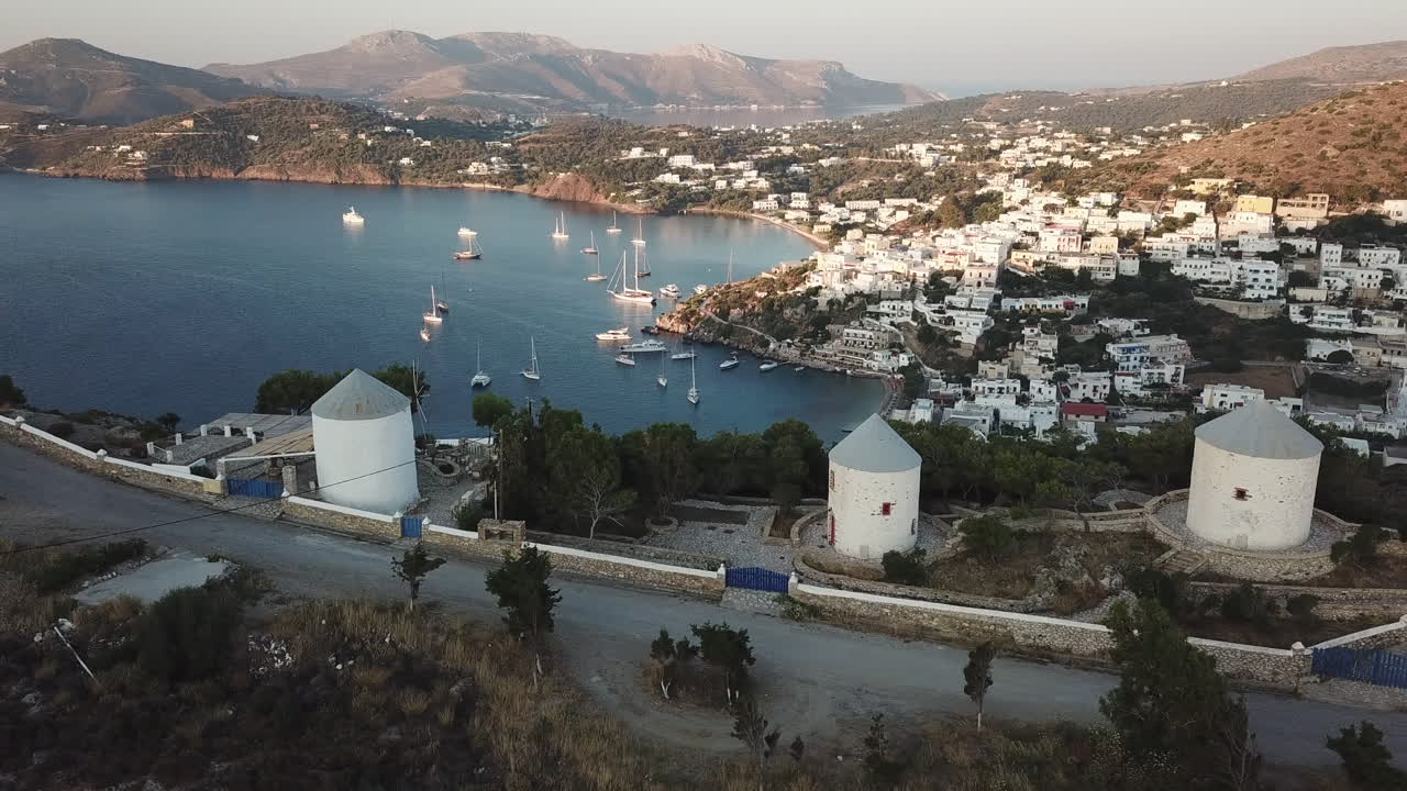 Aerial View of a Picturesque Greek Island Village with Windmills