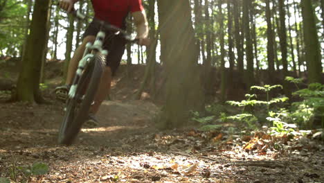 slow motion shot of man riding mountain bike skidding