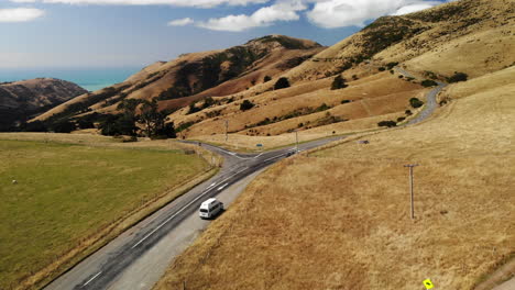 Travel-Van-life-New-Zealand-mountains-and-lake-Drone-following-4k