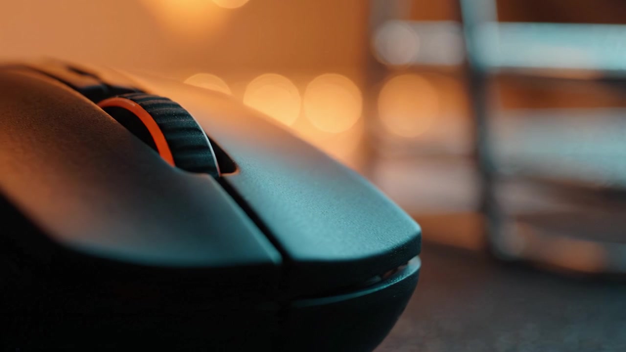 A Close-Up View of a Computer Mouse with Glowing Lights, Highlighting the Design and Functionality in a Softly Lit Environment for Enhanced User Experience