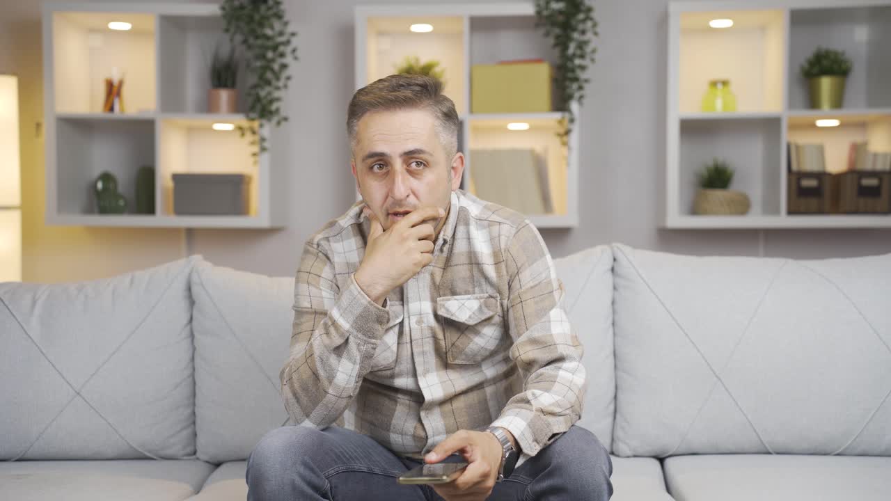 The pessimistic man is confused at home.