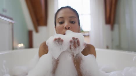 mixed race woman taking a bath