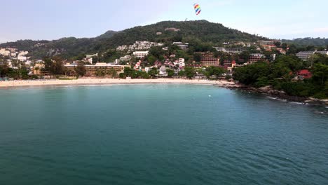 Aerial-View-Of-Parasailer-Over-Kata-Beach-In-Phuket