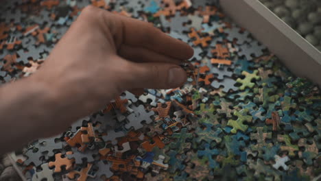 hand trying find the missing piece to a puzzle