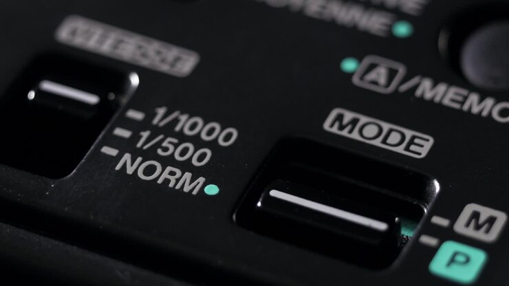 Close up of camcorder mode and shutter speed controls in low light