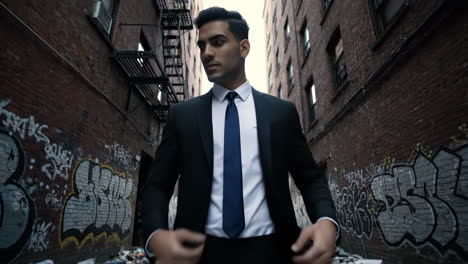 man in a suit in a gritty urban alley