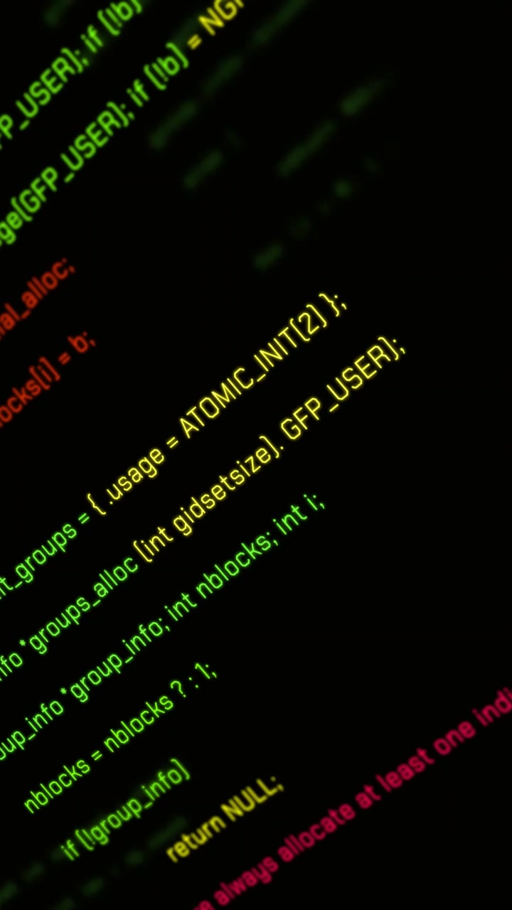 Scrolling C Programming Code on a Dark Computer Screen
