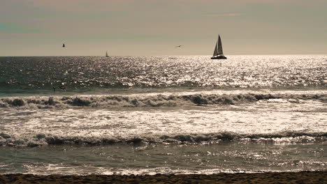 sea view with sailing boat moving at sunset time