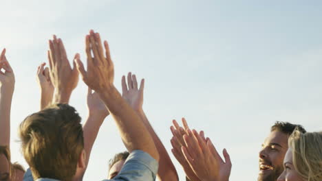 group of friends doing high five