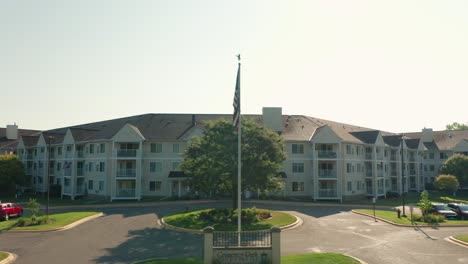 Aerial,-exterior-building-of-senior-care-facility-complex-in-the-United-States-during-the-day