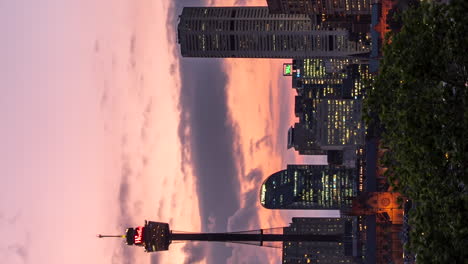 Sunset-to-nighttime-timelapse-of-downtown-Sydney,-Australia---vertical