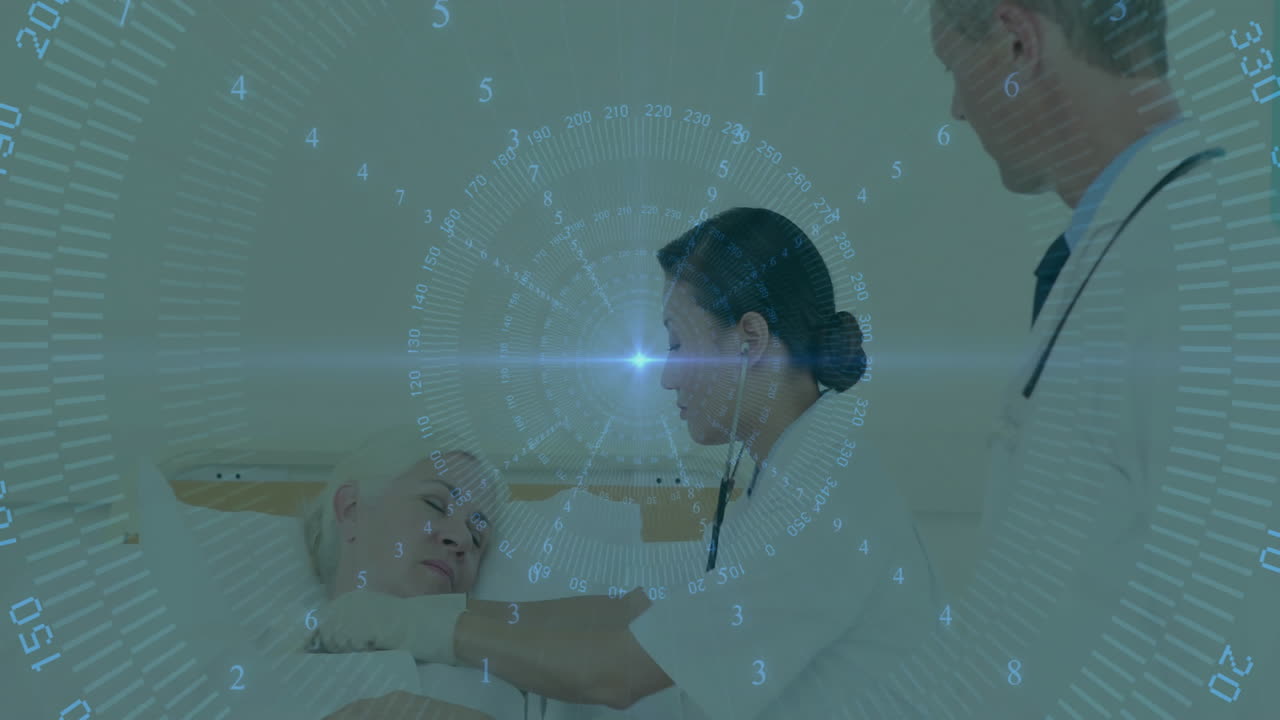 In hospital, doctors using animation data overlay while attending patient