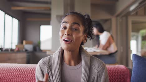 Video-of-happy-biracial-woman-having-video-call-on-laptop