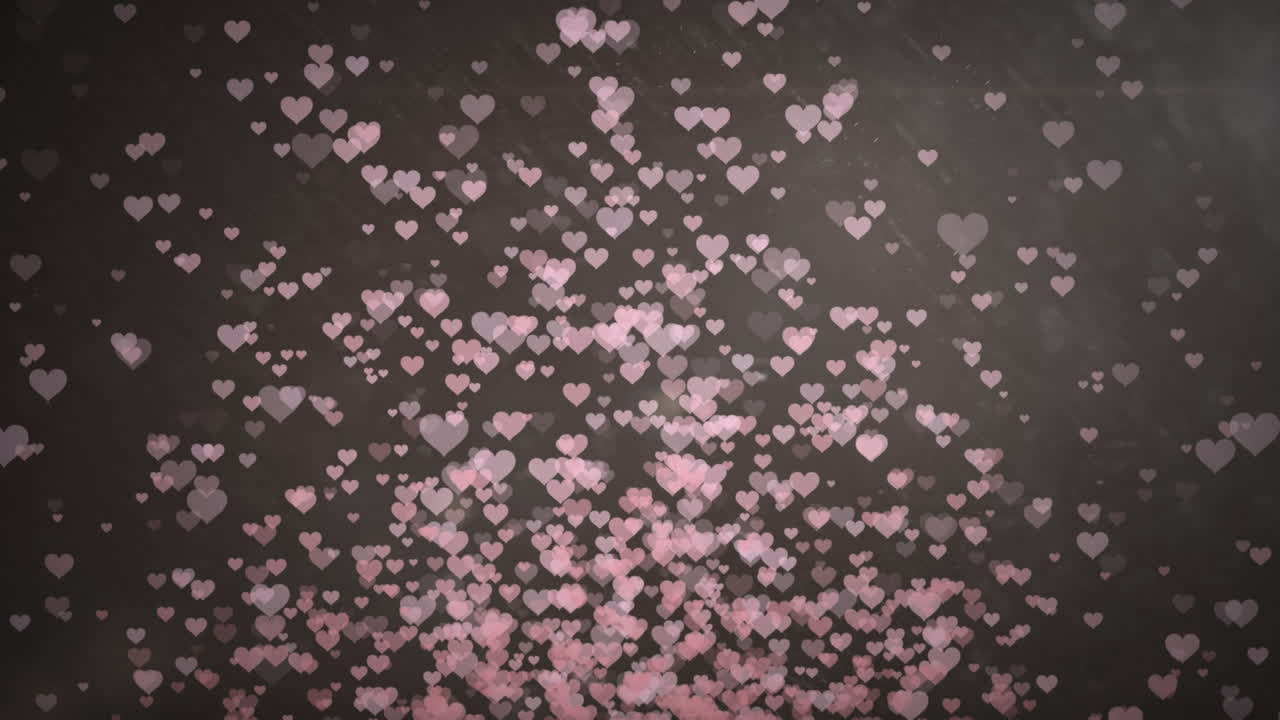 animación de corazones rosados sobre un fondo negro