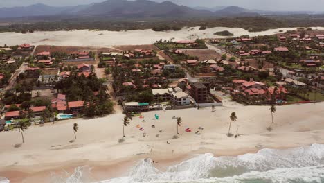 aerial: cumbuco during day with people kitesurfing