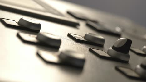 closeup of a person operating a automated industrial machine for manufacturing industry