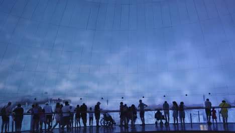 museum exhibit with large projected image of a landscape