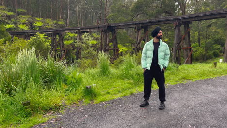 indian sikh man wearing traditional turban in nature landscape