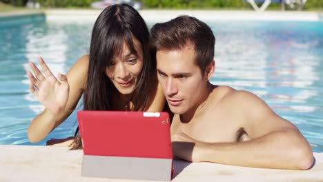 Handsome-couple-with-portable-digital-device