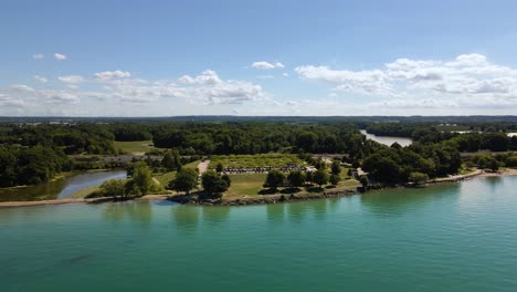 aerial view of a beautiful green park next to an emerald lake ontario