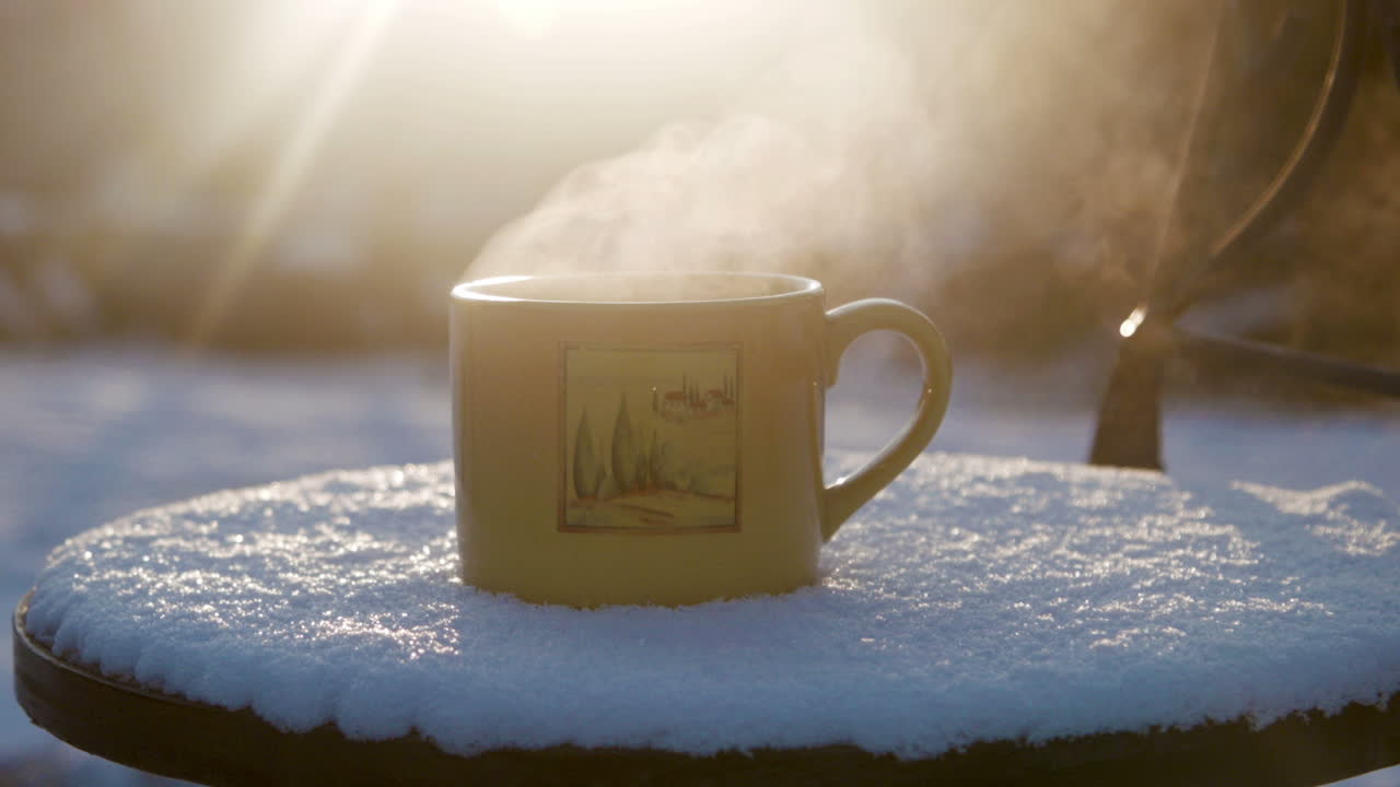 Cup With Hot Tea Against The Sun In The Winter (Stock Footage)