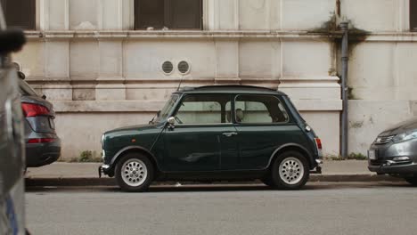 vintage green mini cooper parked on the street