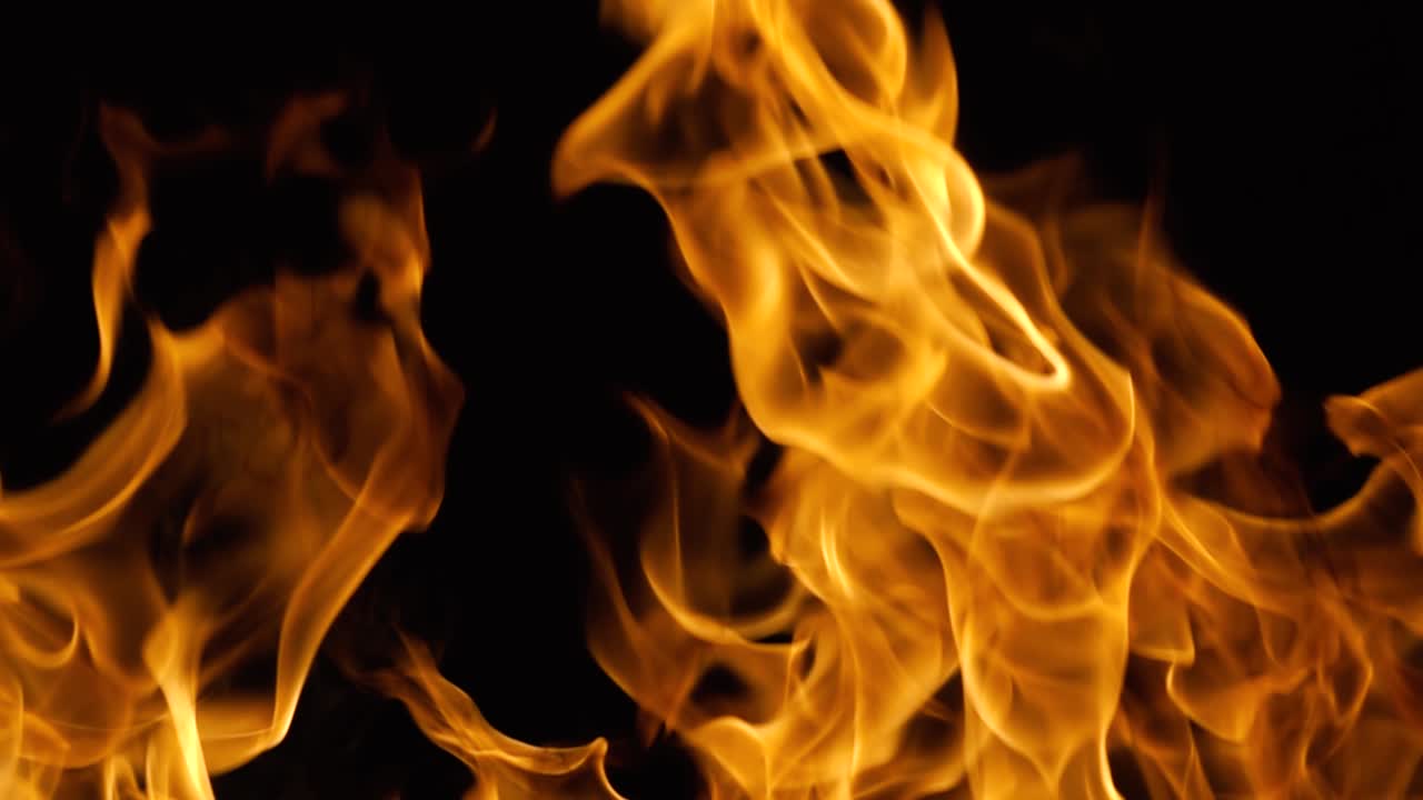 Flames of fire on black background in slow motion