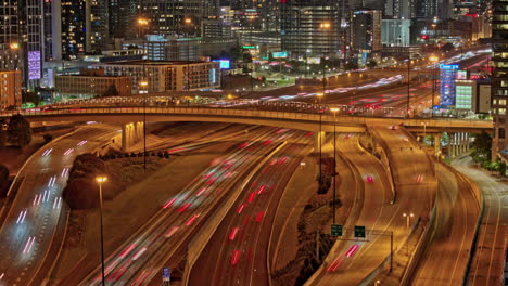 atlanta georgia aerial v884 hyperlapse drone flyover busy interstate freeway capturing speed up traffic trails and night cityscape across midtown and downtown - shot with mavic 3 pro cine - may 2023